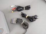 two cables and a charger sitting on a table