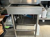 a stainless steel oven sitting in the middle of a kitchen