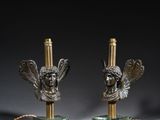 pair of bronze and marble lamps with angel heads on marble bases