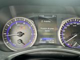 a close up of a car dashboard with various gauges