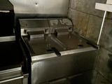 an image of a kitchen with a stove and a washer