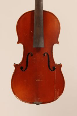 an old violin with a bow hanging from it ' s back