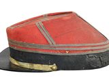 a red hat with a black band on top of it