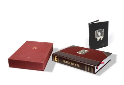 two books sitting next to each other on a white surface