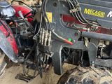 a tractor that is parked in a garage