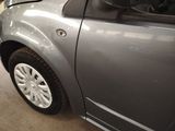 a car that is parked in a garage with the door open