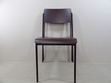 a chair that is sitting in the corner of a room