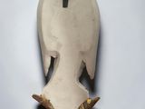 sculpture of a bird with wings on a white background