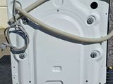 a washing machine with a hose attached to it
