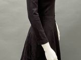 an image of a mannequin wearing a black dress
