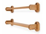 a pair of wooden hooks on a white wall