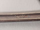 a close up of a spoon with a handle on a table