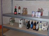 many bottles of alcohol on the shelves in the room