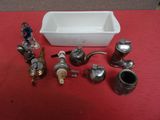 many different types of plumbing items on a red table