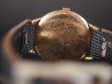 an image of a close up of a watch on a table
