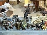 a lot of figurines on a shelf in a store