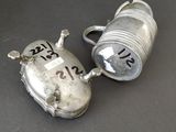 pair of silver plated salt and pepper shakers with numbers on them