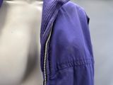 a mannequin torso with a purple jacket on it
