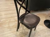 a chair and a table in a room with wood flooring