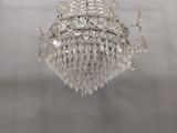 a crystal chandelier hanging from a ceiling in a room