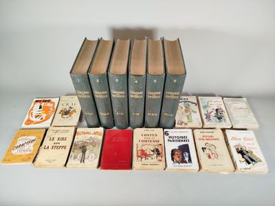 several books are stacked on top of each other on a table