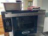 a microwave that is sitting on a counter in a kitchen