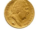 une image d'une pièce d'or sur fond blanc