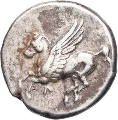 a close up of a silver coin with a bird on it