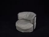 an image of a chair in the dark with a black background