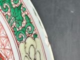 a close up of a plate with a design on it