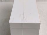 a white box that has a toothbrush inside of it