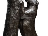 sculpture of two dogs playing with each other on a white background