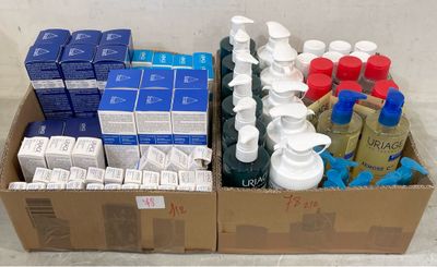 a cardboard box filled with many different types of cleaning products