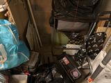 a pile of luggage sitting on the floor next to a chair