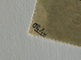 a stamp on a piece of paper on a table