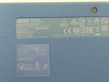 a close up of a blue laptop computer with buttons on it