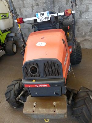 a tractor that is parked in a garage
