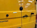 a yellow van that is parked in a garage
