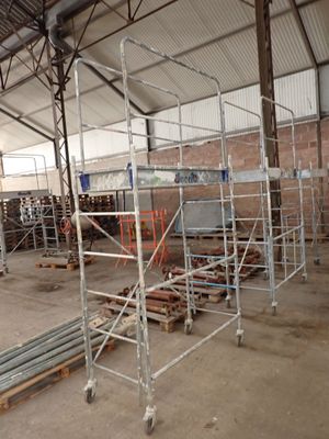many scaffoldings in a building that is under construction