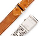 an image of a wrist watch and a bracelet on a white surface