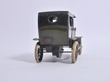 a small toy car that is sitting on a white surface