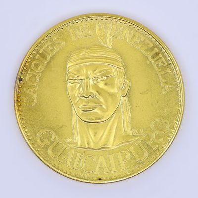 a gold coin with a picture of a man on it