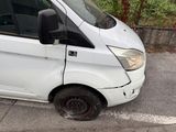 a white van that is parked in a parking lot