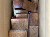 a cardboard box full of old books in it