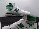 the new balance shoes are white and green with a black box