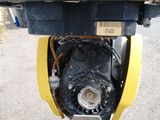 a yellow and black fire hydrant sitting on the side of the road