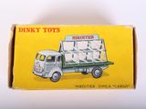 a box with a toy truck inside of it on a table