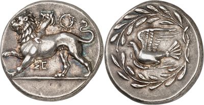 a silver coin with an image of a lion on it