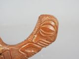 a close up of a carved object on a table