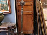 a tall wooden grandfather clock in the corner of a room